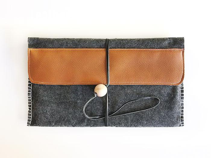 DIY laptop bag - some felt, leather, floss and a wooden bead